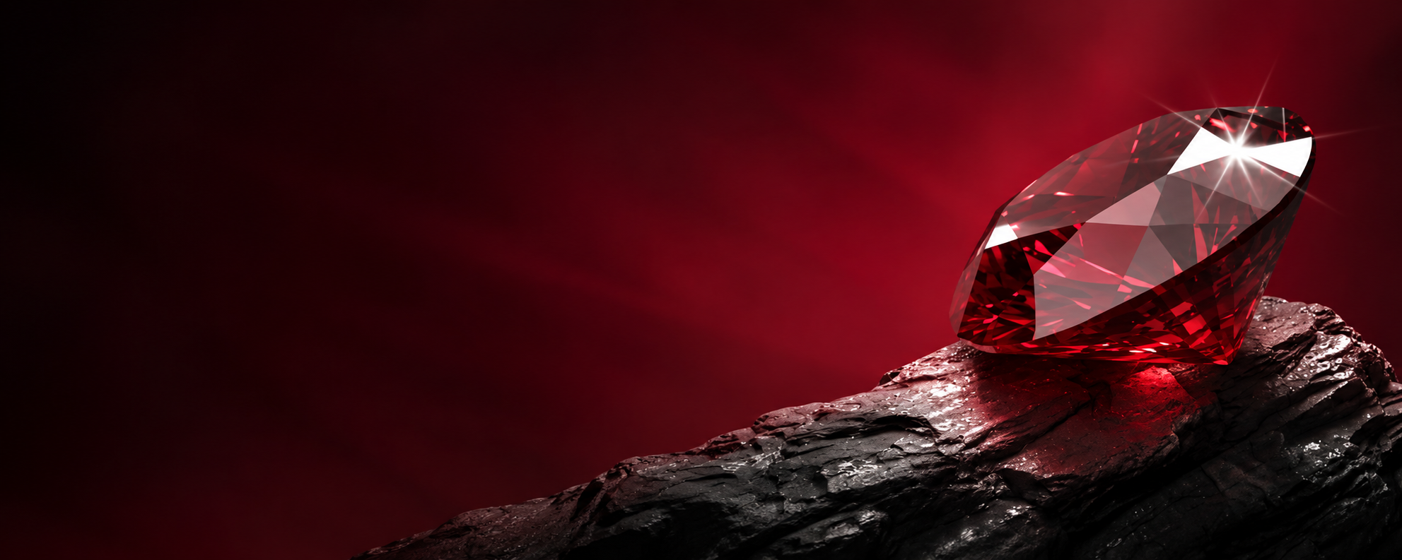 Red gemstone resting on natural stone